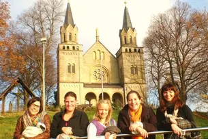 Photos of participants of Bamberg Buddies in front of different Franconian landscapes.