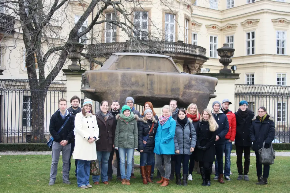 Group photo in front of the modern art.