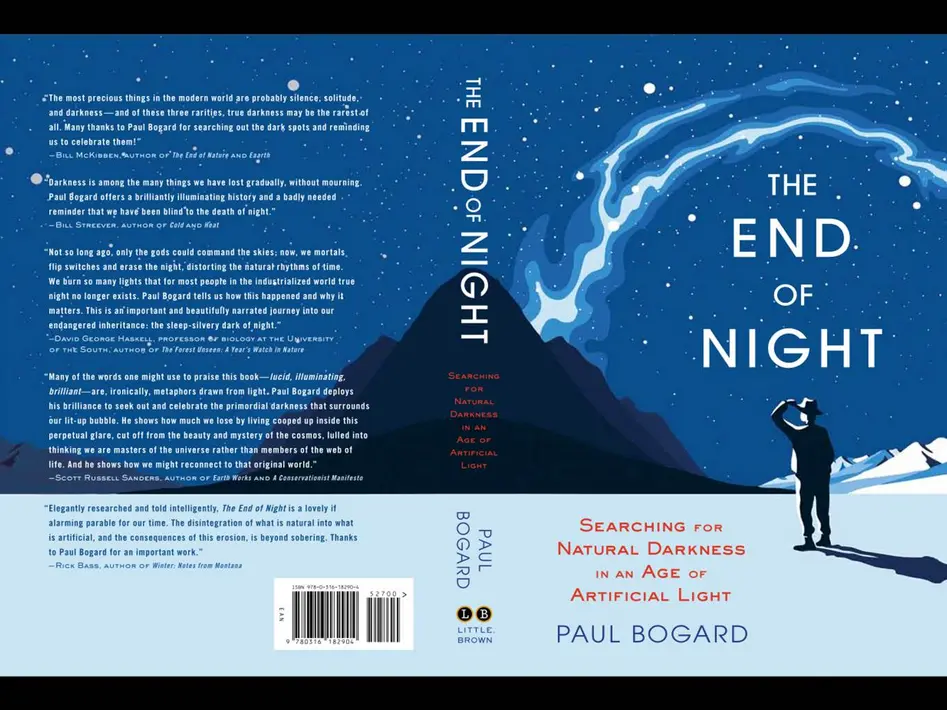 Book cover of The End of Night by Paul Bogart. Depicted is a person looking at the sky in a snowy and dark landscape.